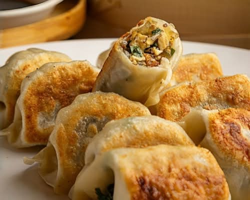 501-1. CHIVES & VERMICELLI DUMPLINGS (FRIED, 10 PCS) 素饺 (煎, 10件)